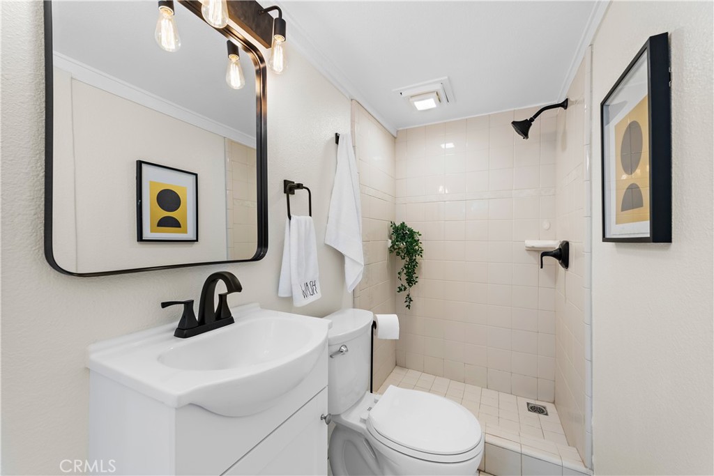 29229 Hazel Bell Drive Silverado, CA 92676 - Photo 20 of 39 a bathroom with a toilet sink and mirror