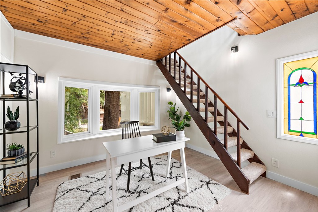 29229 Hazel Bell Drive Silverado, CA 92676 - Photo 24 of 39 a dining room with wooden floor and windows