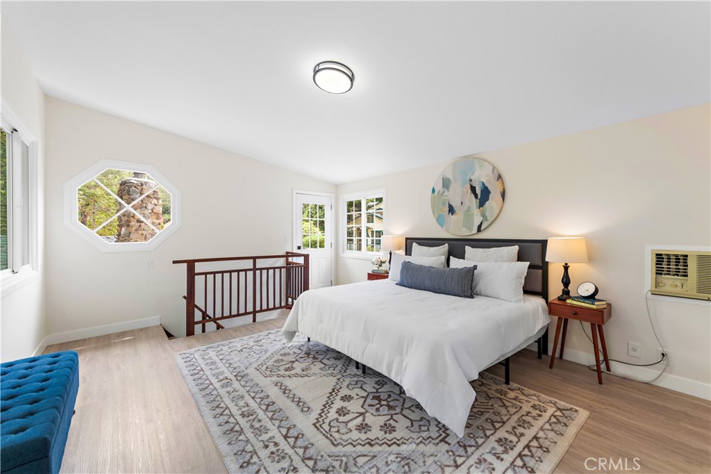 29229 Hazel Bell Drive Silverado, CA 92676 - Photo 25 of 39 a bedroom with a bed and a table in it