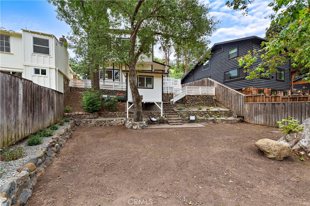 29229 Hazel Bell Drive Silverado, CA 92676 - Photo 35 of 39 a view of a house with a yard and tree s
