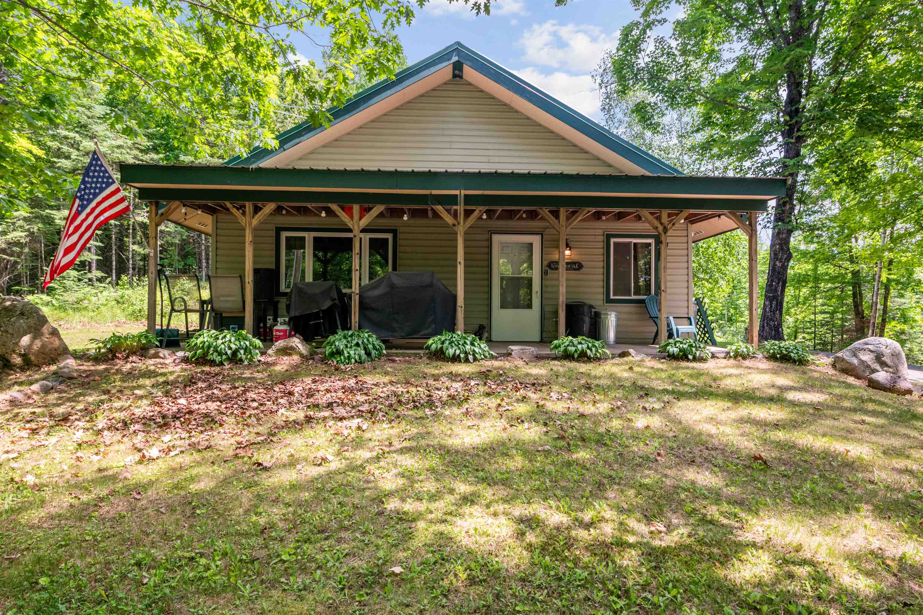 48840 Old Grade Road Cable, WI 54821 - Photo 22 of 22 View of front of property featuring a front yard and a porch