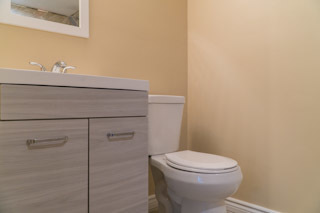 18406 Bock Road Lansing, IL 60438 - Photo 17 of 20 a bathroom with a toilet and a sink