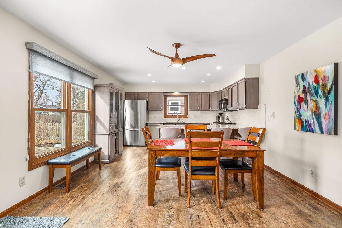 540 Parkside Drive Elburn, IL 60119 - Photo 11 of 38 a view of a dining room with furniture a rug and wooden floor