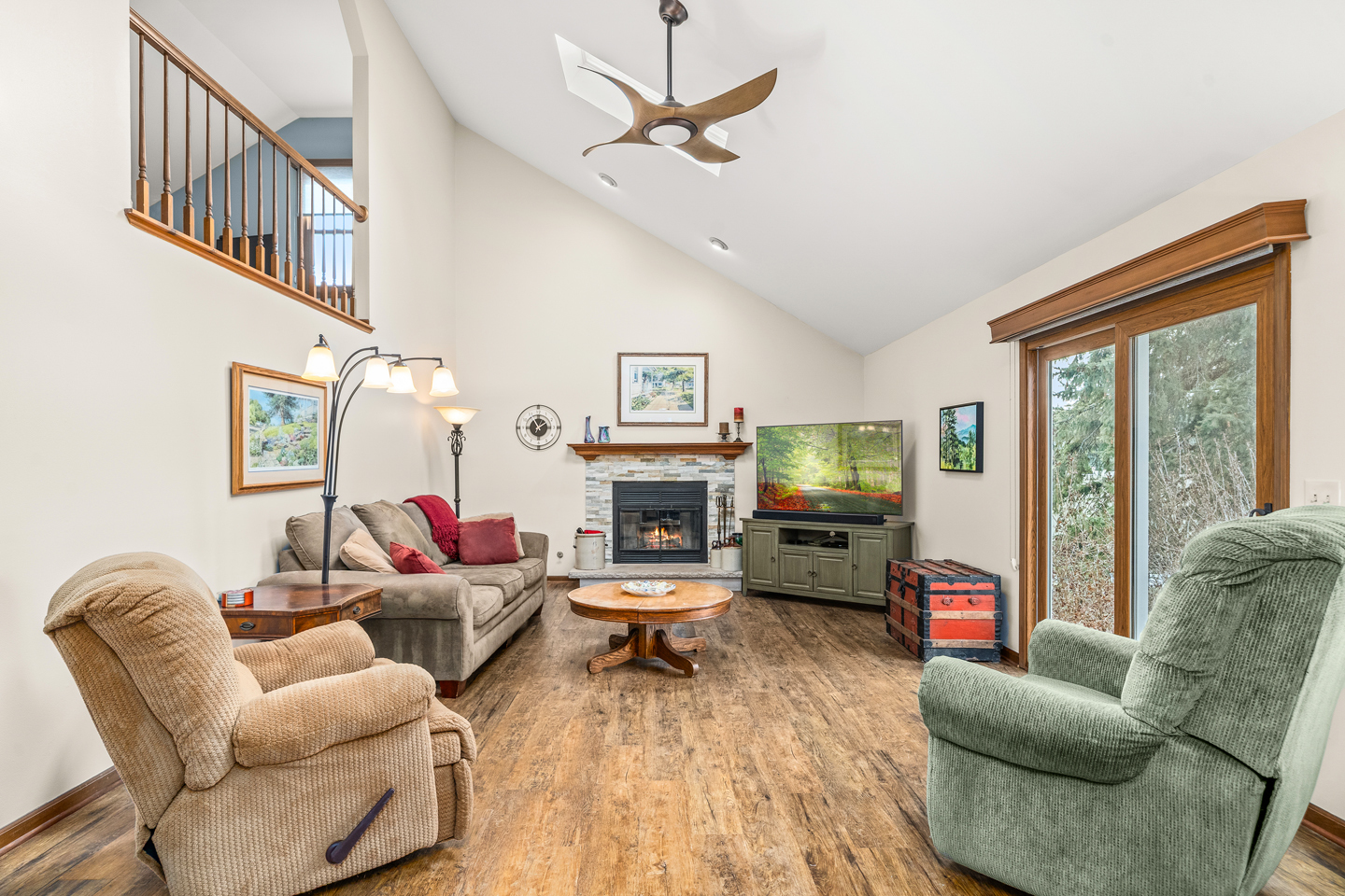 540 Parkside Drive Elburn, IL 60119 - Photo 15 of 38 a living room with furniture a fireplace and a flat screen tv