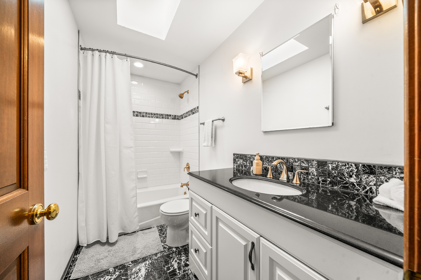 540 Parkside Drive Elburn, IL 60119 - Photo 27 of 38 a bathroom with a granite countertop sink a toilet and a mirror