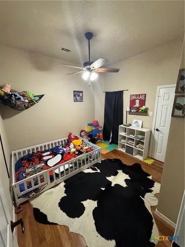 a room with furniture and a flat screen tv