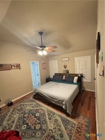 a bedroom with bed and window