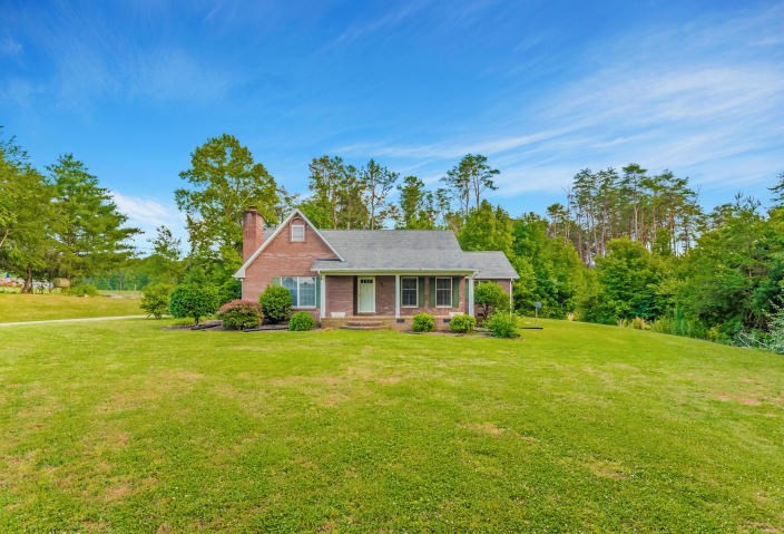848 County Farm Road Madisonville, TN 37354 - Photo 1 of 1 a front view of a house with a garden