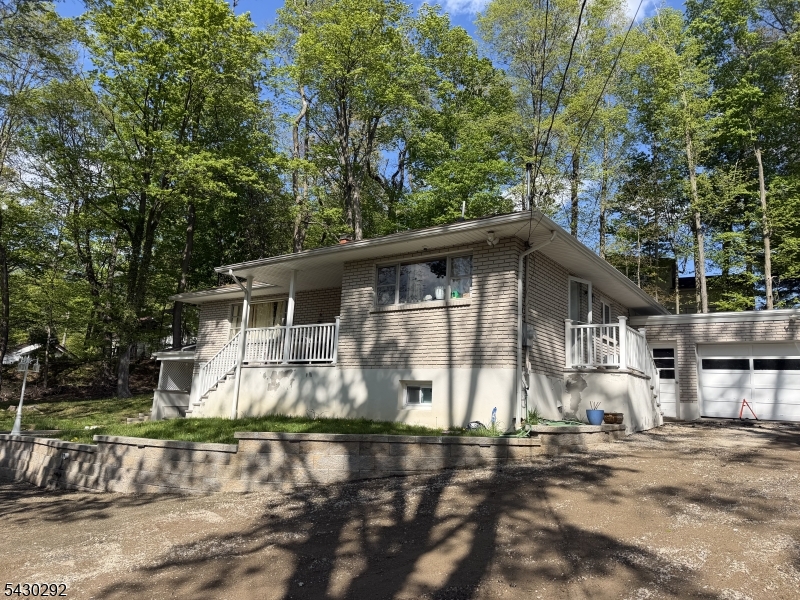 775 Tabor Road Morris Plains, NJ 07950 - Photo 1 of 21 a front view of a house with a yard