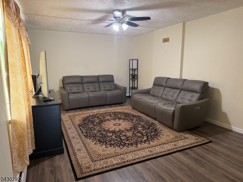 775 Tabor Road Morris Plains, NJ 07950 - Photo 16 of 21 a living room with furniture and a rug