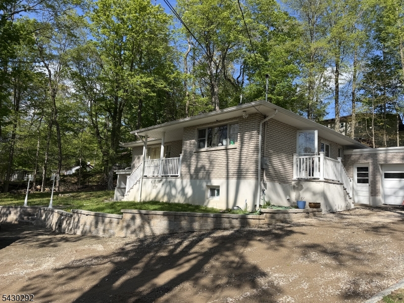 775 Tabor Road Morris Plains, NJ 07950 - Photo 2 of 21 a view of a house with a yard