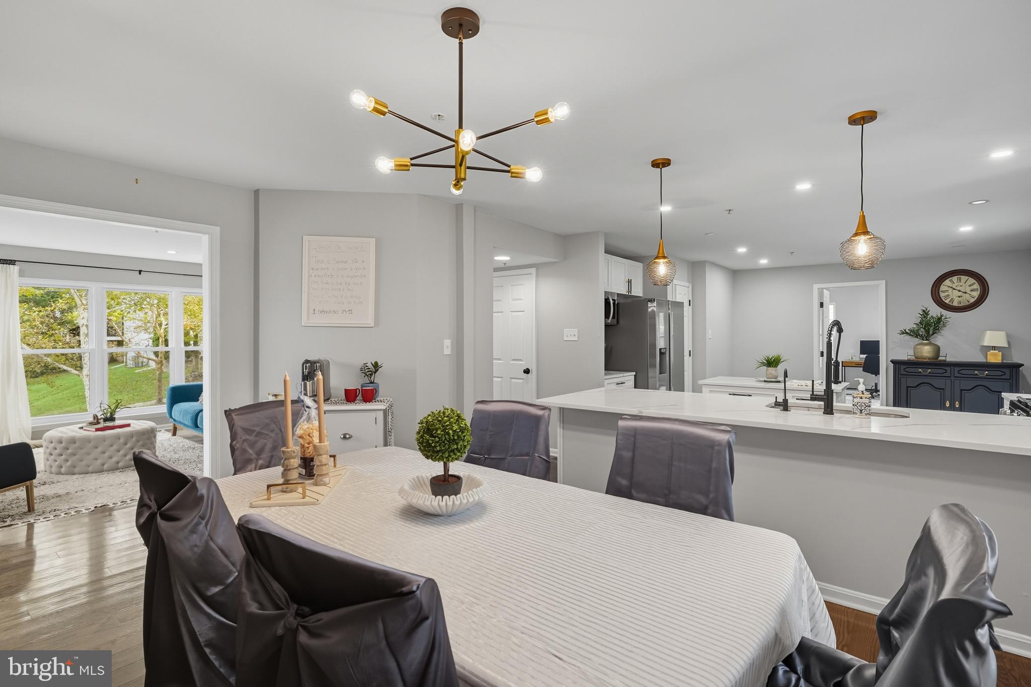 3100 Hillside Avenue Cheverly, MD 20785 - Photo 11 of 58 a dining room with stainless steel appliances kitchen island granite countertop furniture and a large window