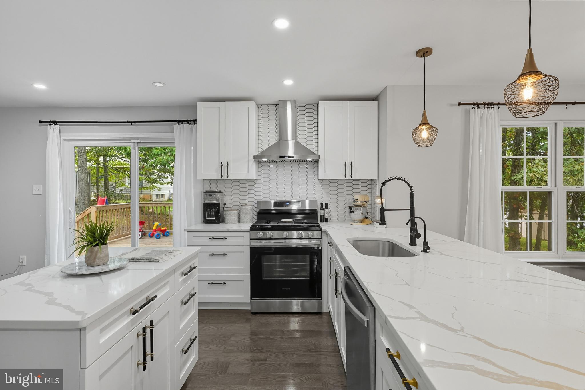 3100 Hillside Avenue Cheverly, MD 20785 - Photo 12 of 58 a kitchen with a stove a sink and a refrigerator