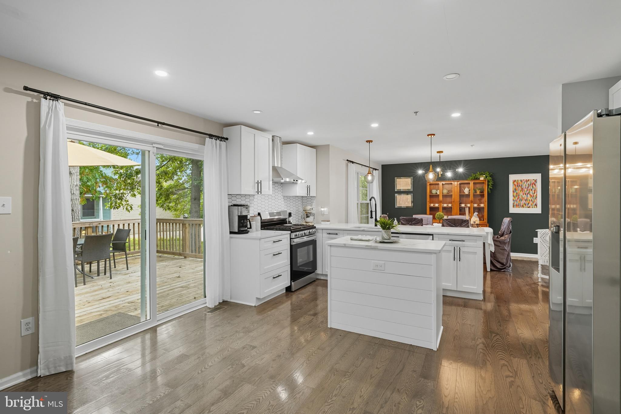 3100 Hillside Avenue Cheverly, MD 20785 - Photo 14 of 58 a kitchen with a refrigerator and a stove top oven