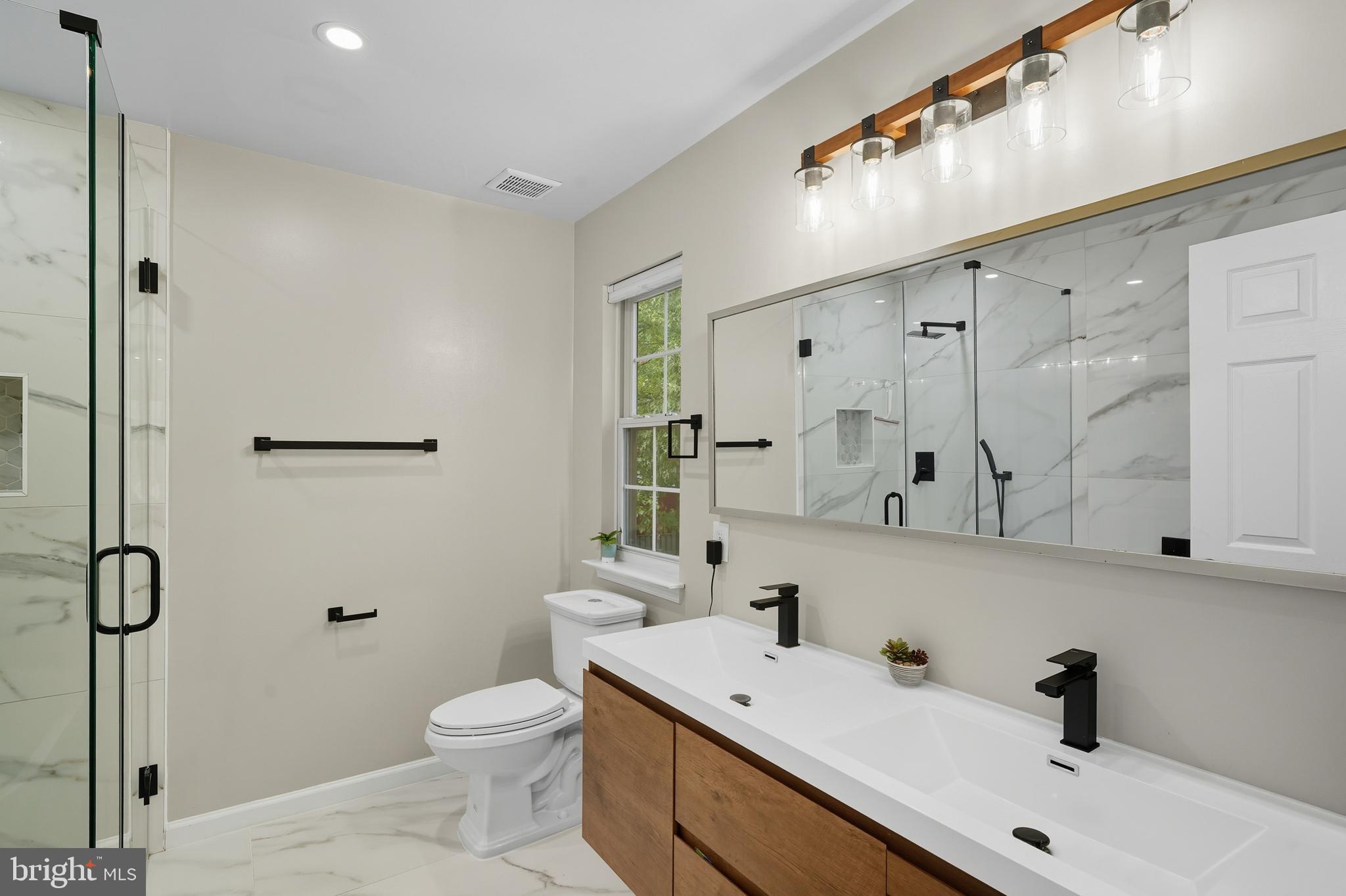 3100 Hillside Avenue Cheverly, MD 20785 - Photo 25 of 58 a bathroom with a sink a toilet and shower