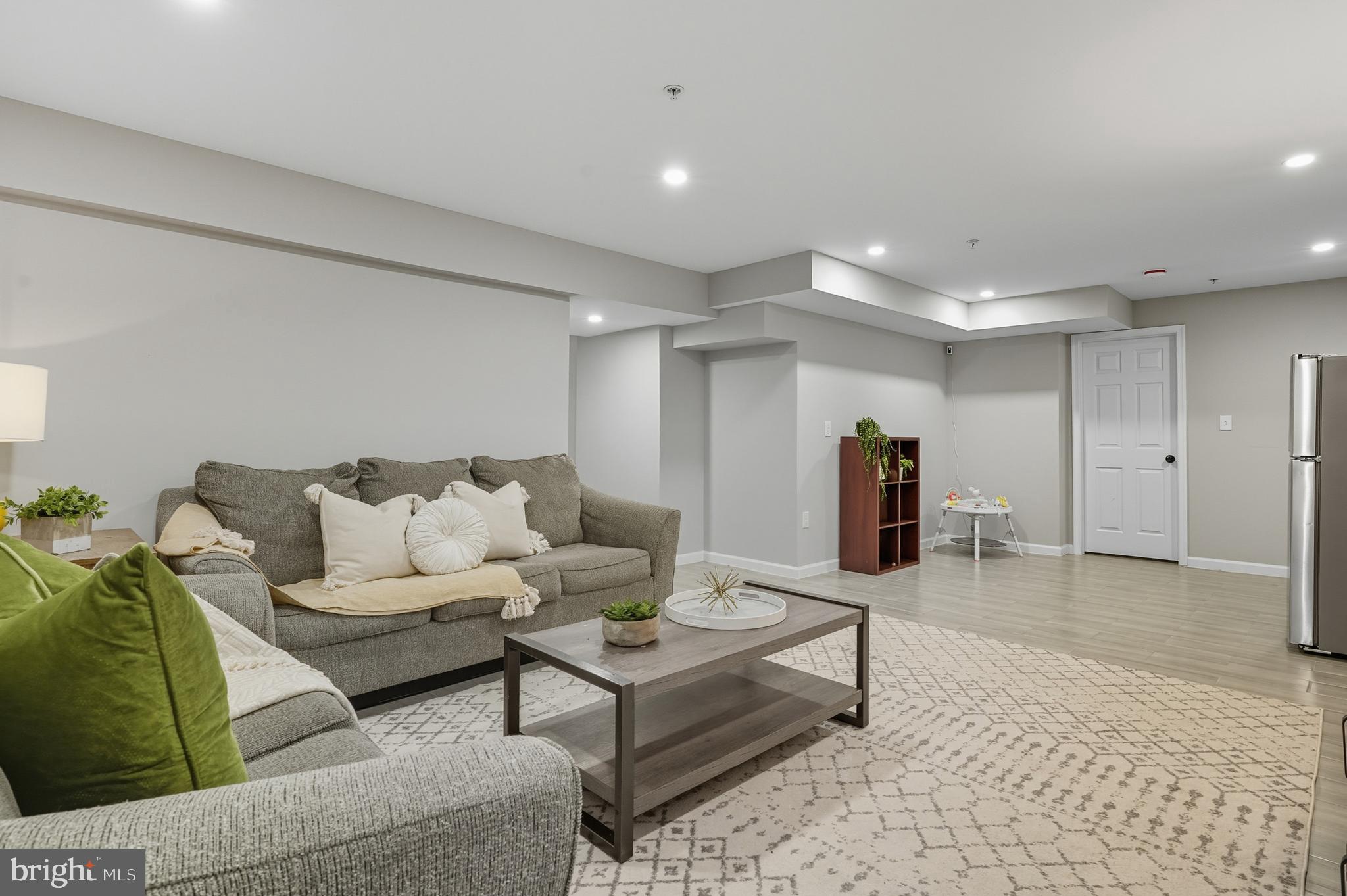 3100 Hillside Avenue Cheverly, MD 20785 - Photo 33 of 58 a living room with furniture and a rug