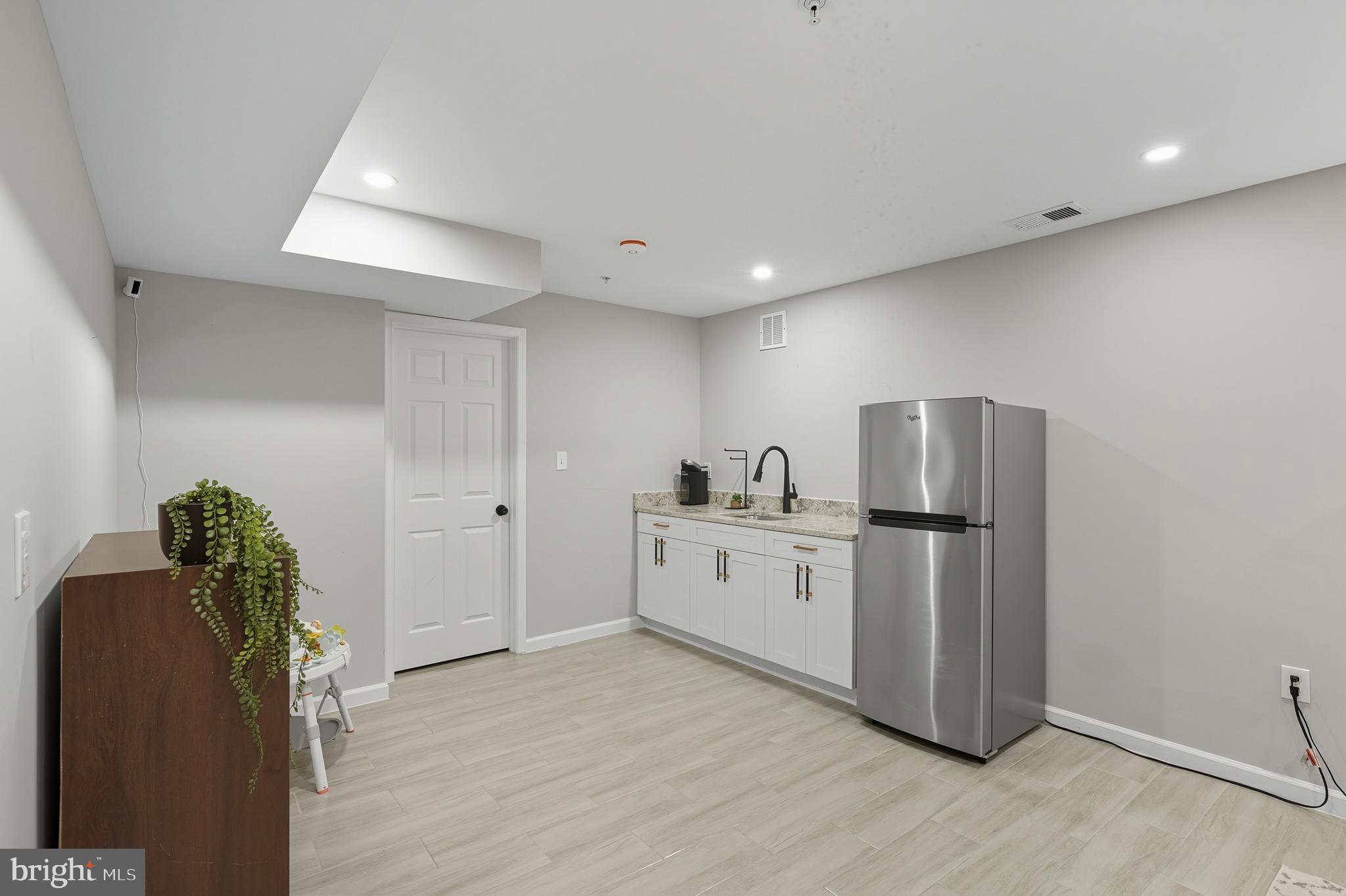 3100 Hillside Avenue Cheverly, MD 20785 - Photo 35 of 58 a kitchen with refrigerator and cabinets