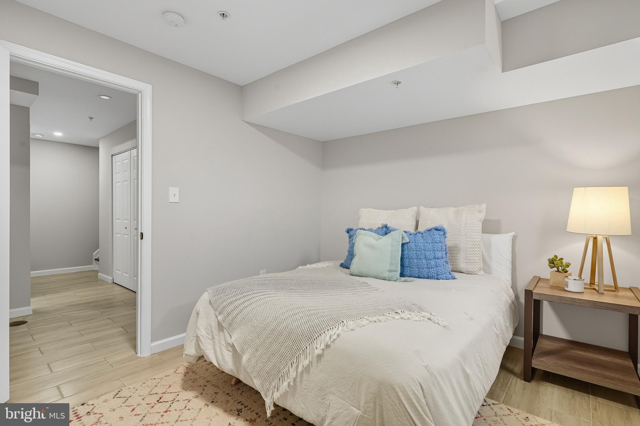 3100 Hillside Avenue Cheverly, MD 20785 - Photo 40 of 58 a bedroom with a bed and a lamp