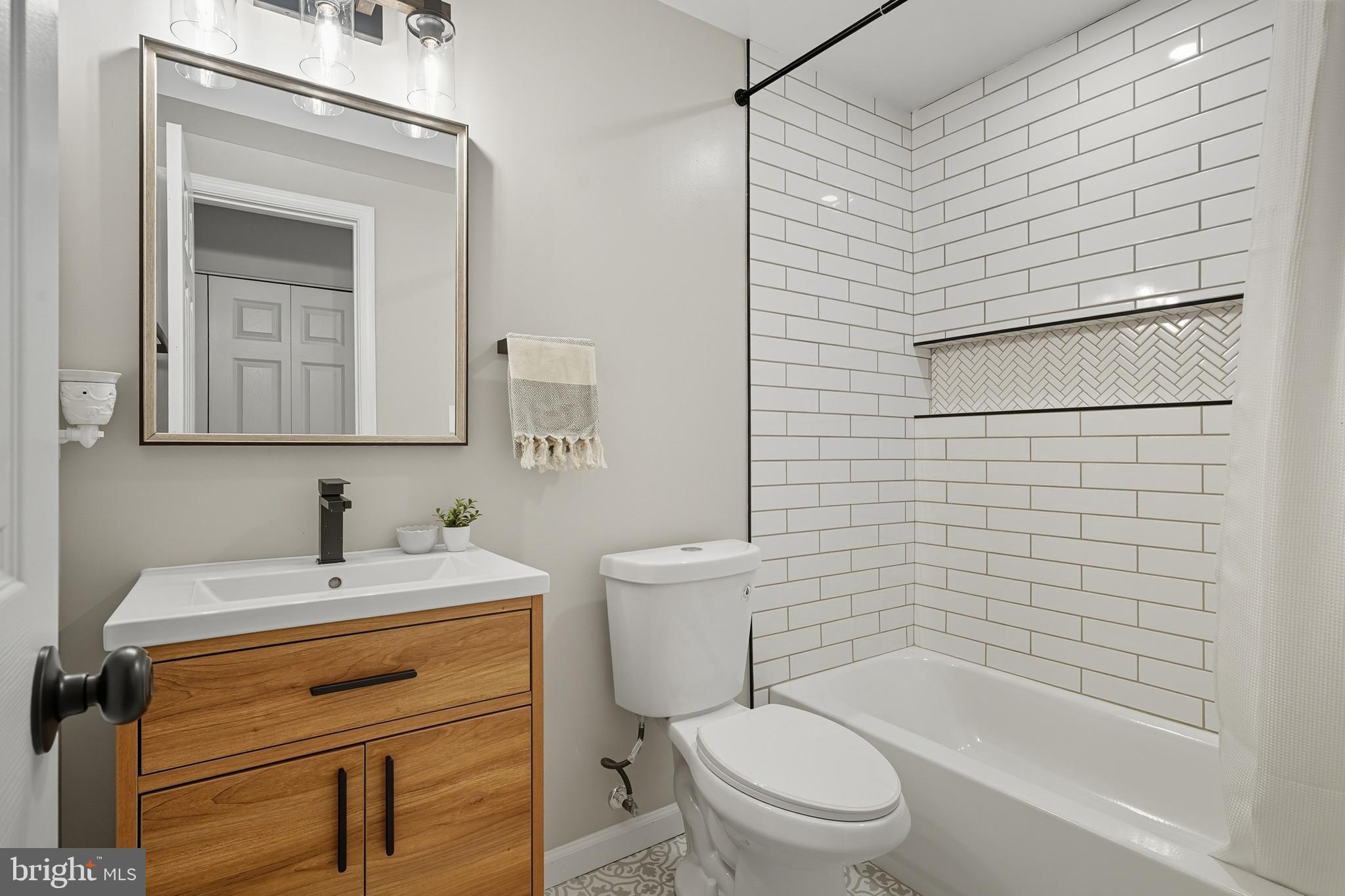 3100 Hillside Avenue Cheverly, MD 20785 - Photo 41 of 58 a bathroom with a sink toilet and shower