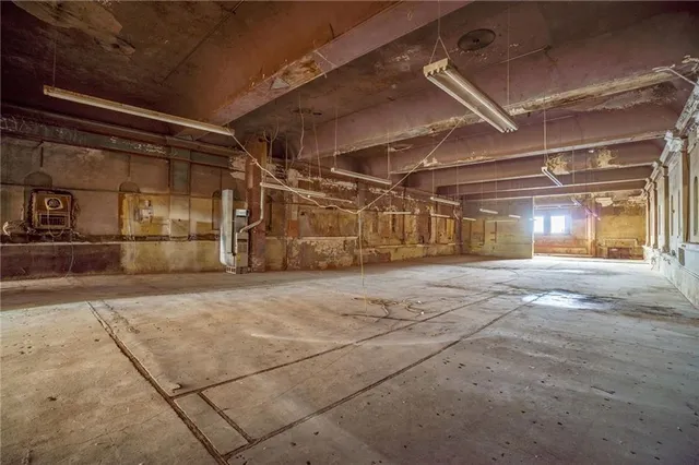 a view of empty room with wooden walls