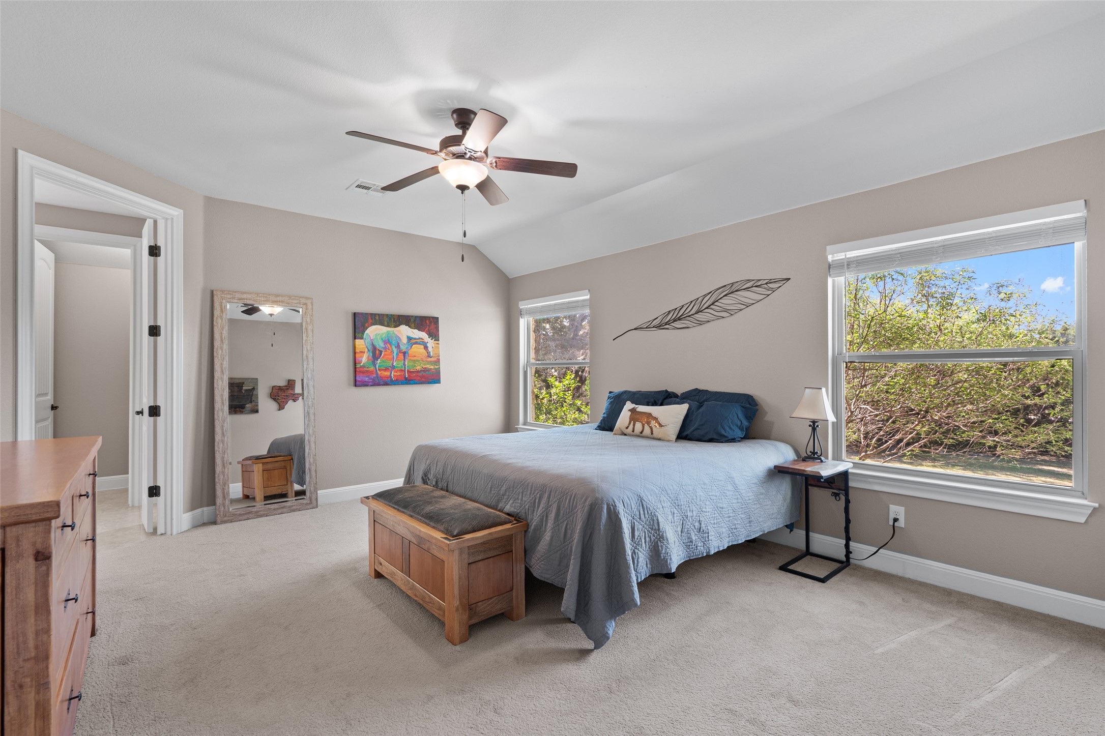 164 Milestone Road Liberty Hill, TX 78642 - Photo 17 of 40 Main floor primary bedroom with lots of light.