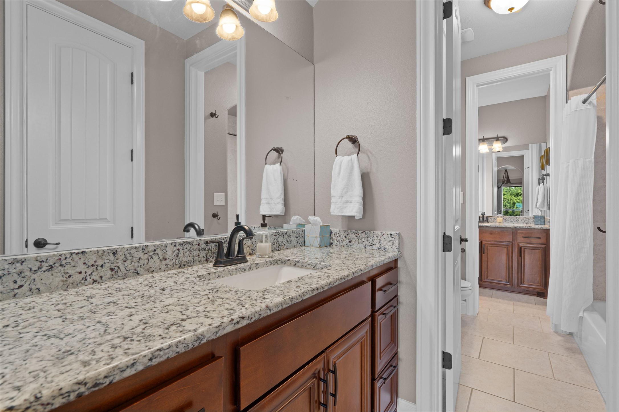 164 Milestone Road Liberty Hill, TX 78642 - Photo 22 of 40 Full bath with vanity, shower / tub combo.