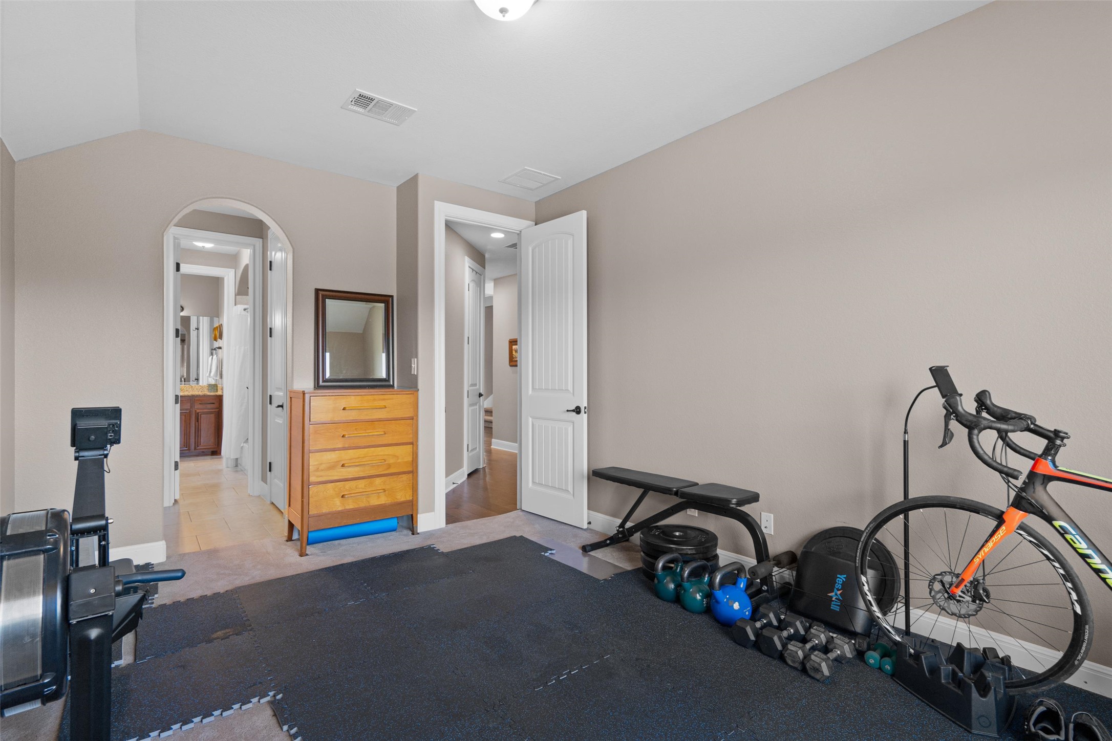 164 Milestone Road Liberty Hill, TX 78642 - Photo 23 of 40 3rd main floor bedroom with a jack and jill bathroom currently being used as an exercise room.