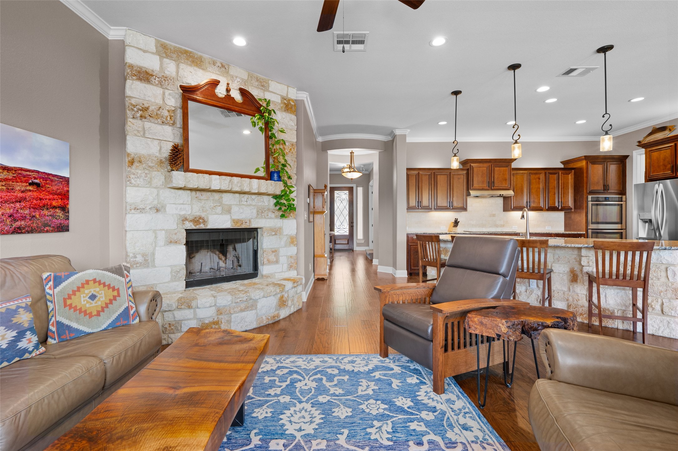 164 Milestone Road Liberty Hill, TX 78642 - Photo 10 of 40 Beautiful stone fireplace is a focal point in this well maintained home.