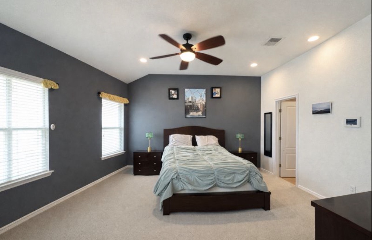 1052 Hot Spring Valley Buda, TX 78610 - Photo 15 of 36 Bedroom featuring vaulted ceiling, ceiling fan, carpet flooring, and recessed lighting