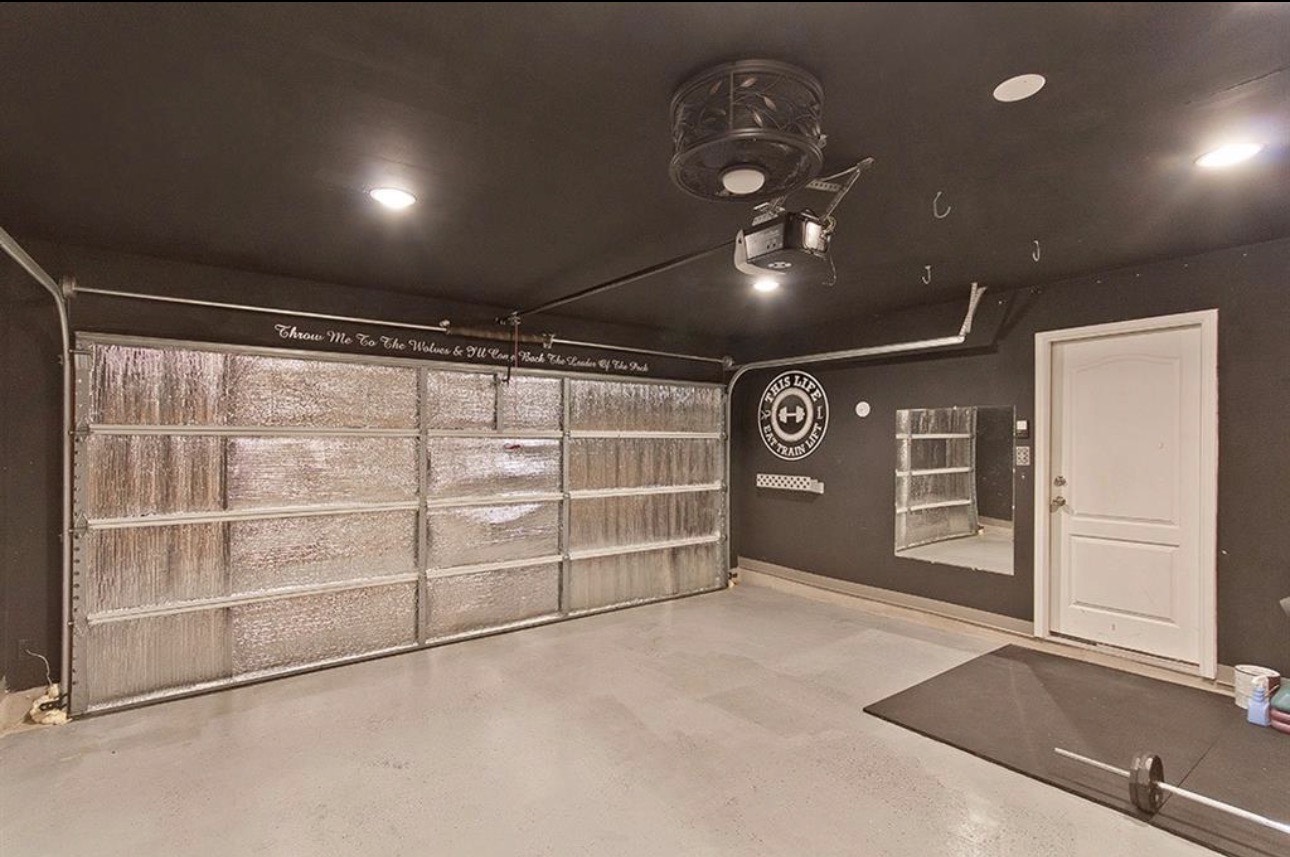 1052 Hot Spring Valley Buda, TX 78610 - Photo 30 of 36 Garage with a garage door opener and recessed lighting