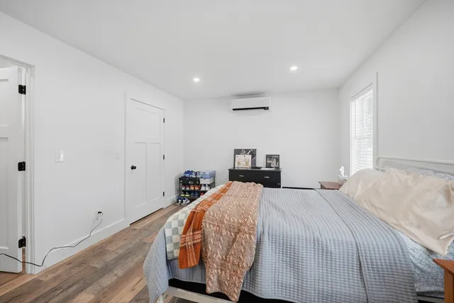 a bed room with a bed and a window