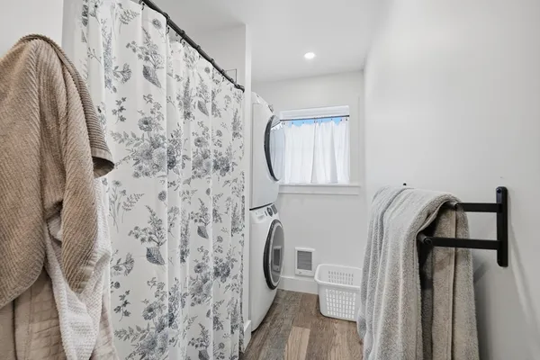 a bathroom with a bathtub and shower