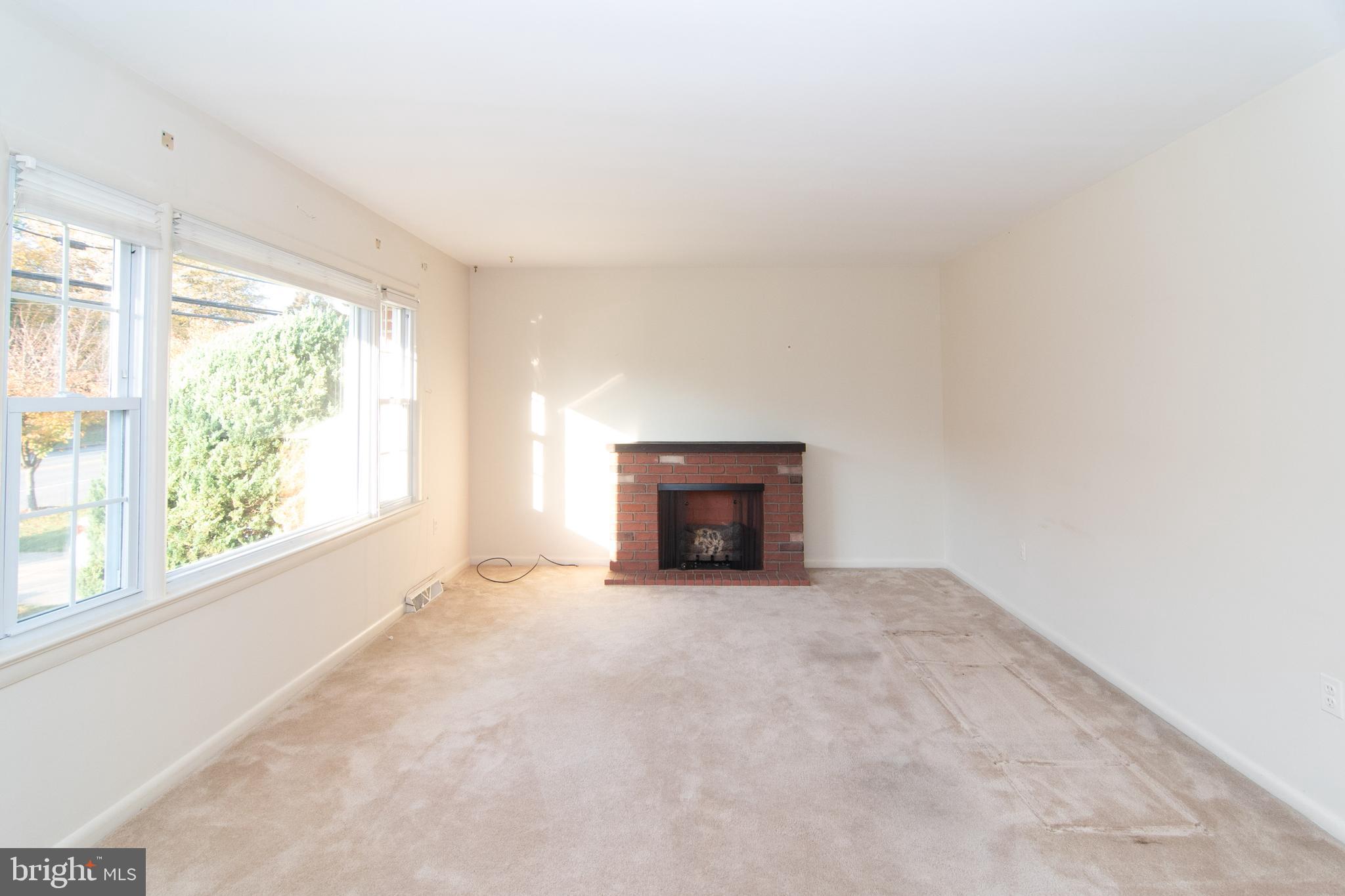 7602 Brooklyn Bridge Road Laurel, MD 20707 - Photo 13 of 36 Warm, electric fireplace conveys