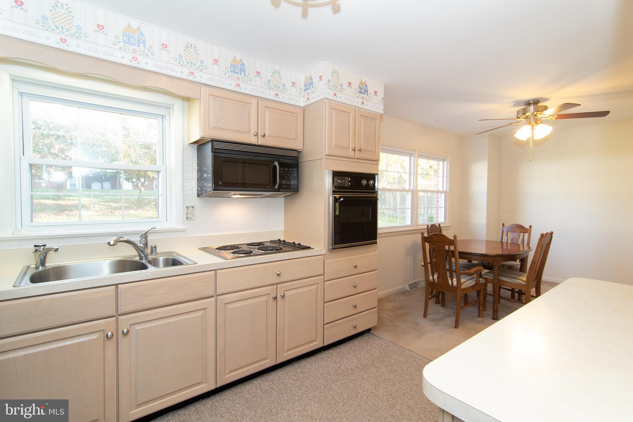 7602 Brooklyn Bridge Road Laurel, MD 20707 - Photo 7 of 36 Cooktop and built-in microwave