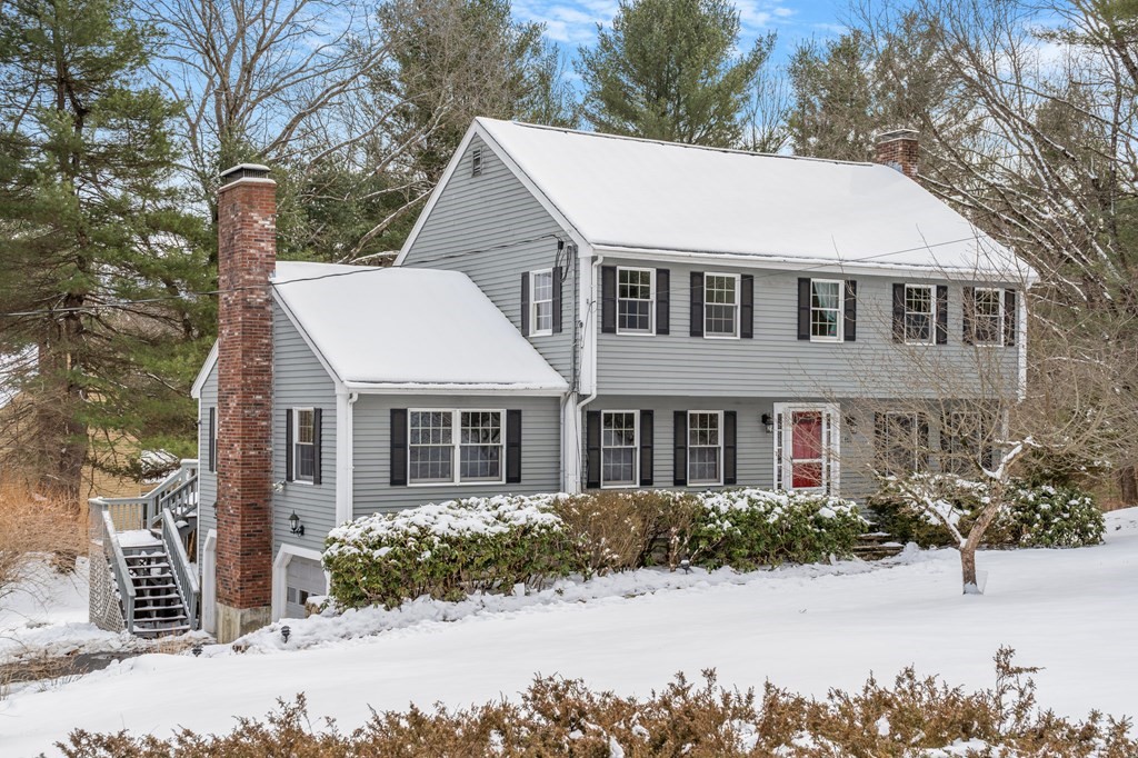 460 Littlefield Road Boxborough, MA 01719 - Photo 1 of 41 a view of a white house next to a yard with large trees