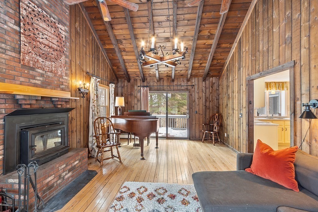 460 Littlefield Road Boxborough, MA 01719 - Photo 11 of 41 a living room with furniture a fireplace and a table