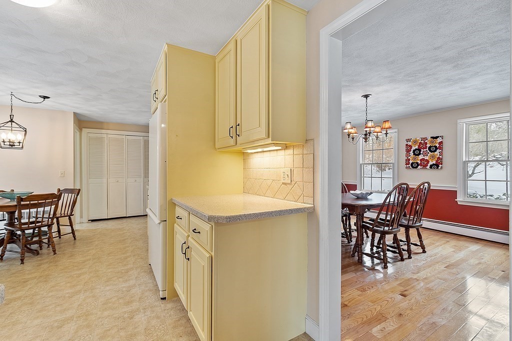 460 Littlefield Road Boxborough, MA 01719 - Photo 14 of 41 a view of a dining table and chairs in a room