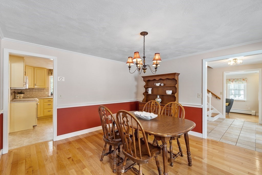 460 Littlefield Road Boxborough, MA 01719 - Photo 15 of 41 a view of a dining room with furniture and wooden floor