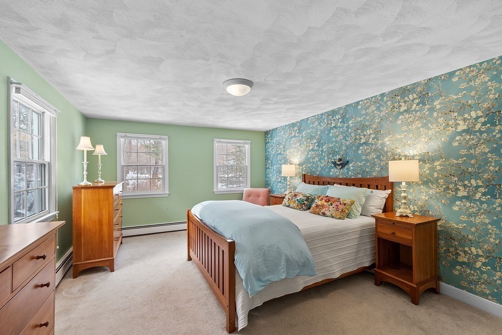 460 Littlefield Road Boxborough, MA 01719 - Photo 18 of 41 a bedroom with a bed and a dresser next to a window