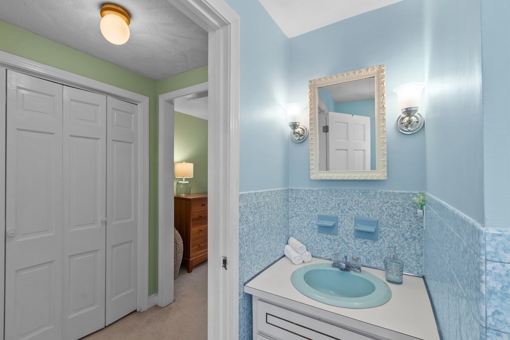 460 Littlefield Road Boxborough, MA 01719 - Photo 23 of 41 a bathroom with a sink and a mirror