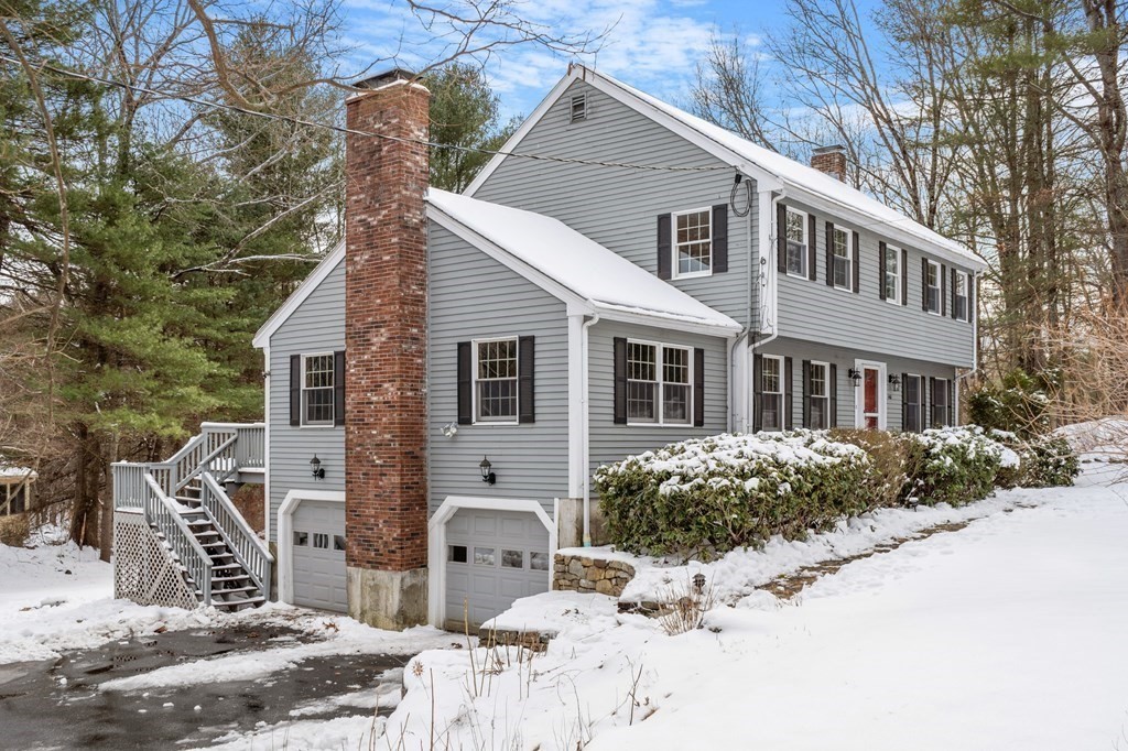 460 Littlefield Road Boxborough, MA 01719 - Photo 28 of 41 a front view of a house with a yard