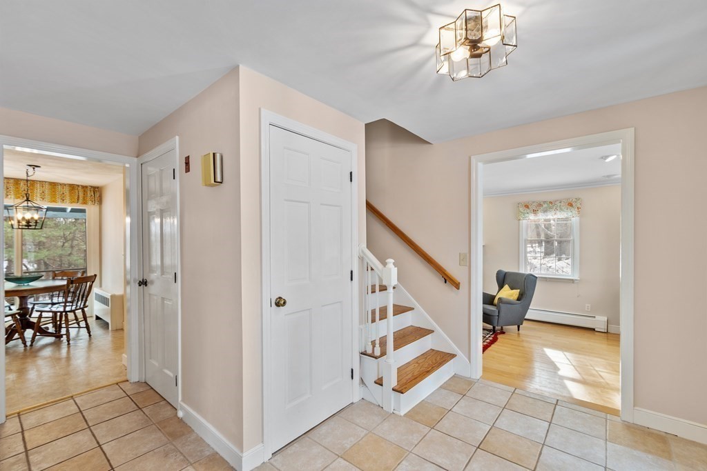 460 Littlefield Road Boxborough, MA 01719 - Photo 3 of 41 a view of an entryway with wooden floor and a livingroom view