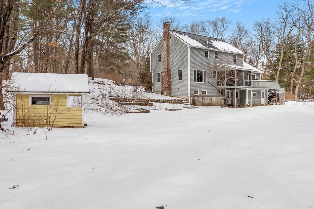 460 Littlefield Road Boxborough, MA 01719 - Photo 31 of 41 a view of a house with snow on the road