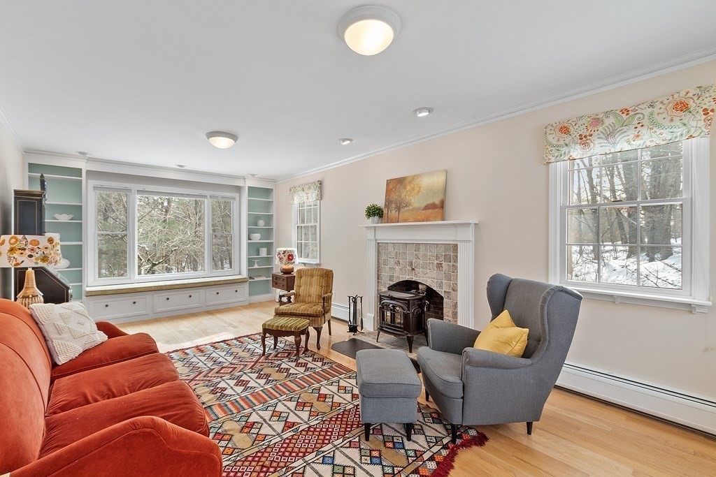 460 Littlefield Road Boxborough, MA 01719 - Photo 4 of 41 a living room with furniture a fireplace and a large window