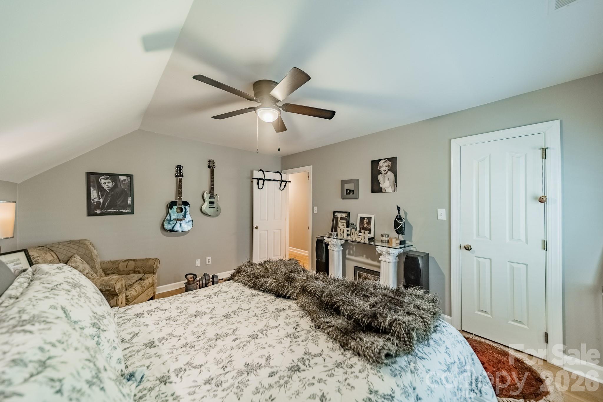 11043 Seven Coves Drive Tega Cay, SC 29708 - Photo 31 of 45 a bedroom with a large bed and a dresser