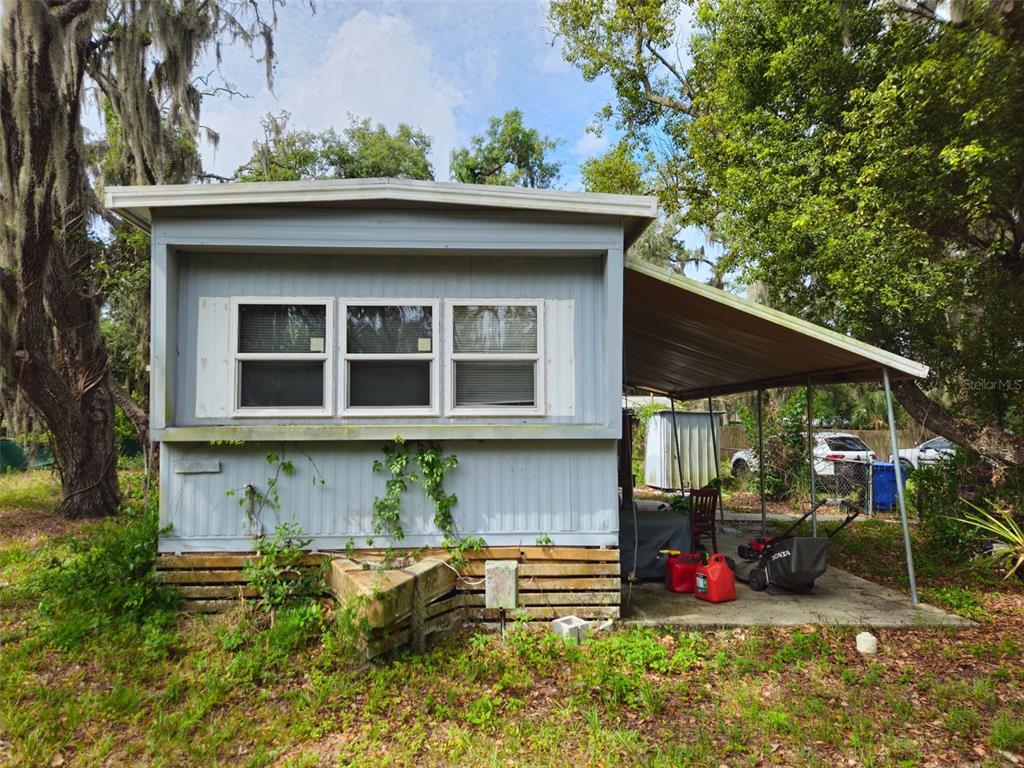 8603 Alafia Ridge Road Riverview, FL 33569 - Photo 3 of 13 a front view of a house with a yard