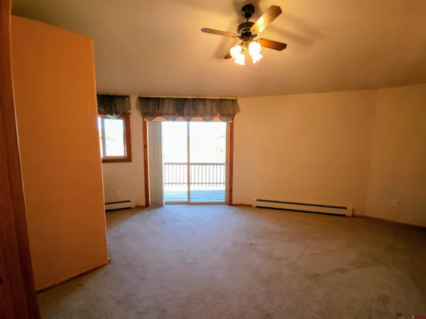 a view of a hallway with seating space