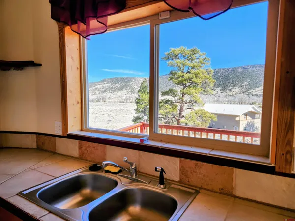 a view of a balcony with chairs
