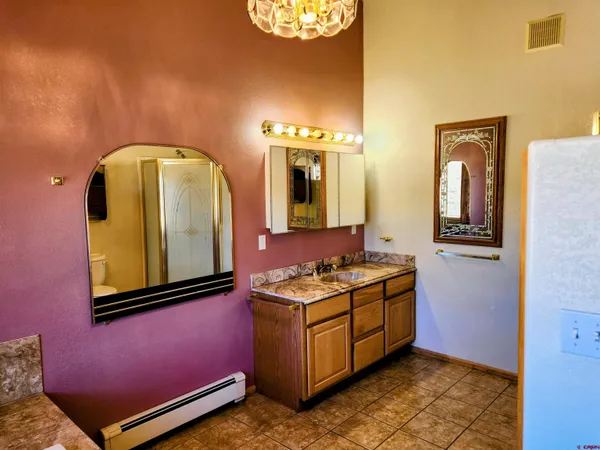 a view of outdoor space with green field and trees