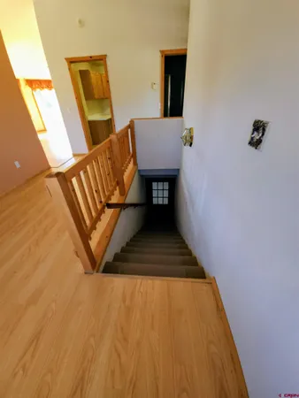 a view of a back yard with a wooden fence